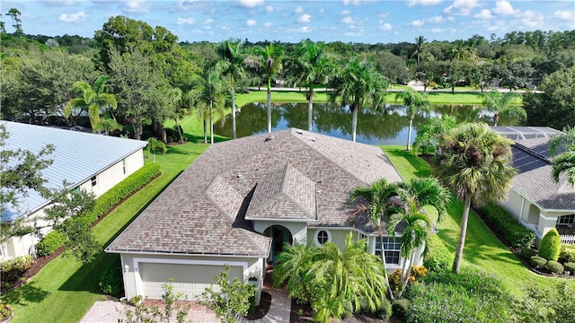 birds eye view of property featuring a water view