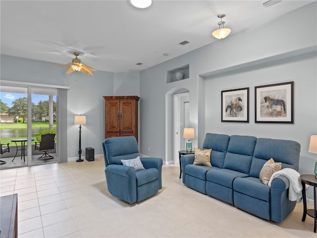 living room featuring ceiling fan and light tile patterned floors