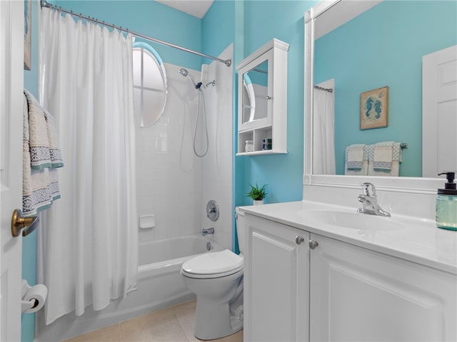 full bathroom featuring tile patterned flooring, vanity, shower / bath combination with curtain, and toilet