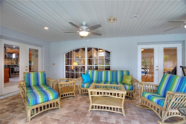 sunroom / solarium featuring french doors