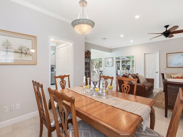 dining space with light tile patterned floors, ceiling fan, and ornamental molding