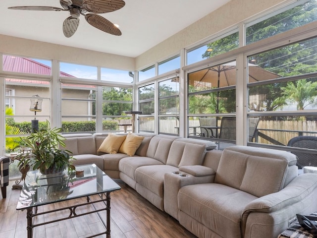 sunroom featuring ceiling fan