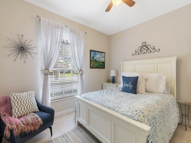 tiled bedroom with ceiling fan