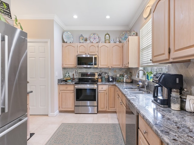 kitchen with sink, light brown cabinets, light stone counters, crown molding, and appliances with stainless steel finishes