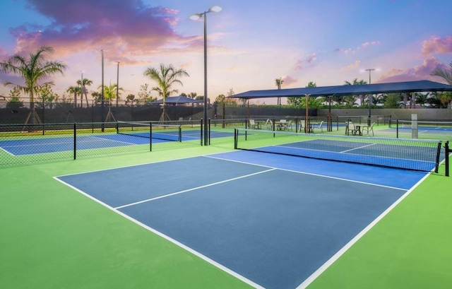 view of tennis court with fence
