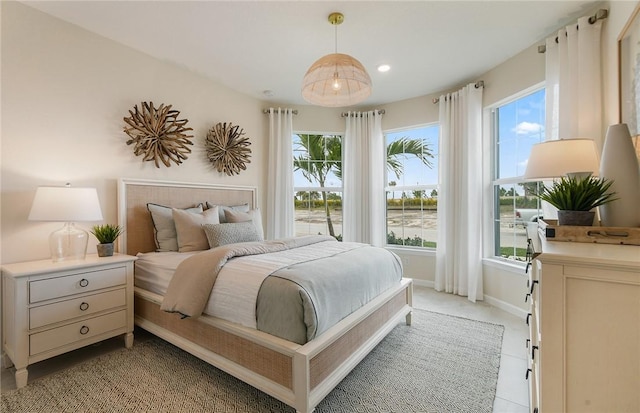 bedroom featuring baseboards, light carpet, and recessed lighting