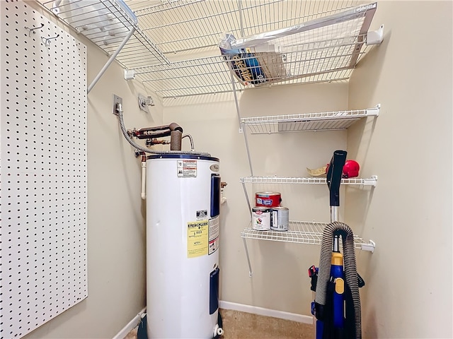 utility room featuring electric water heater