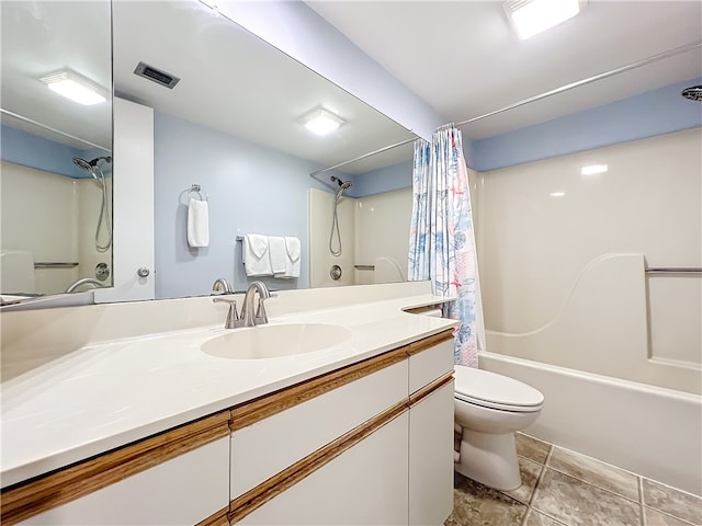 full bathroom featuring tile patterned flooring, shower / tub combo, vanity, and toilet