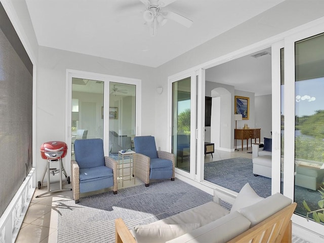 5235 W Harbor Village Dr, Vero Beach, FL 32967 - sunroom with a ceiling fan, visible vents, and an outdoor hangout area