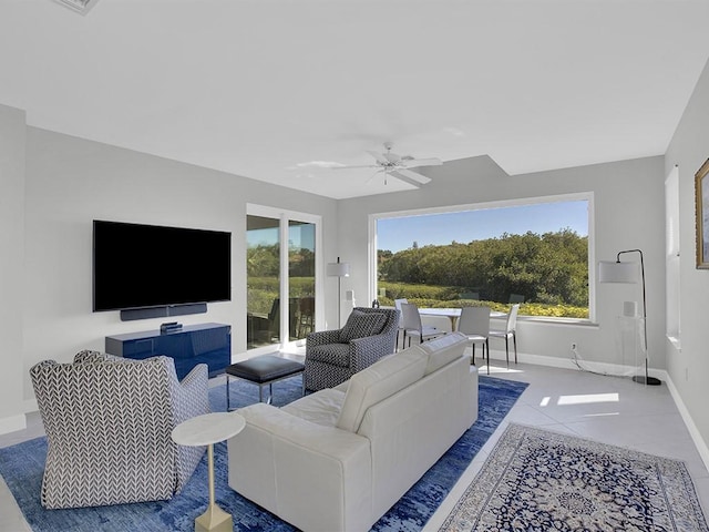 5235 W Harbor Village Dr, Vero Beach, FL 32967 - tiled living area with baseboards and ceiling fan