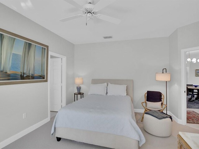 5235 W Harbor Village Dr, Vero Beach, FL 32967 - carpeted bedroom featuring visible vents, ceiling fan, and baseboards