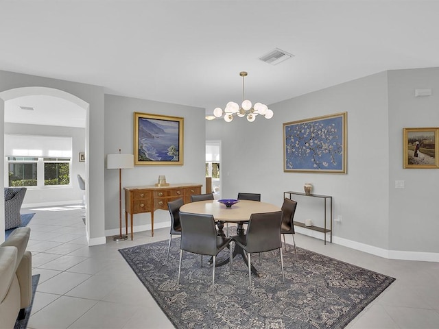 5235 W Harbor Village Dr, Vero Beach, FL 32967 - dining area with arched walkways, visible vents, tile patterned flooring, and baseboards
