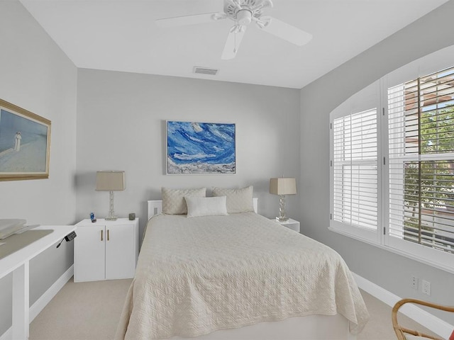 5235 W Harbor Village Dr, Vero Beach, FL 32967 - bedroom with baseboards, light colored carpet, visible vents, and ceiling fan