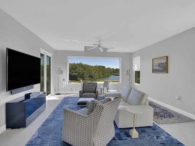 5235 W Harbor Village Dr, Vero Beach, FL 32967 - living area featuring tile patterned floors, baseboards, and ceiling fan