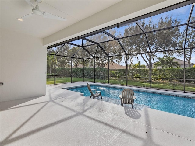 view of swimming pool featuring a lanai, ceiling fan, and a patio