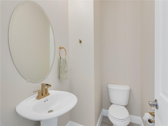 bathroom with toilet and sink