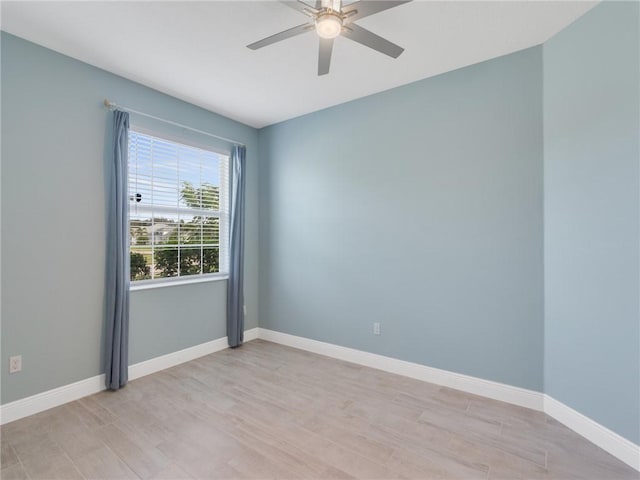 empty room with light hardwood / wood-style floors and ceiling fan