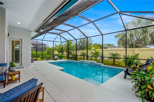 view of swimming pool with a lanai, a patio area, and pool water feature