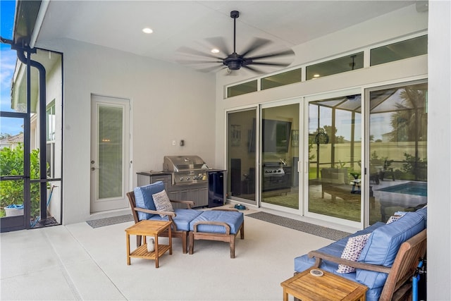 view of patio / terrace with area for grilling and ceiling fan