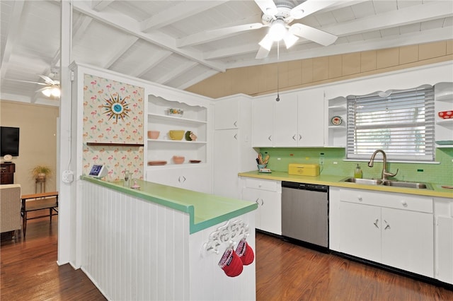 kitchen featuring dark hardwood / wood-style floors, lofted ceiling with beams, dishwasher, sink, and white cabinets