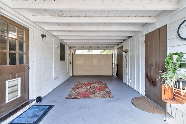 garage featuring wood walls