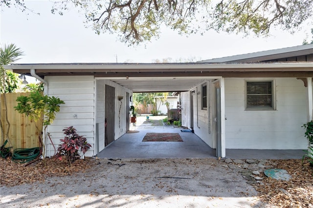 view of side of property with a carport