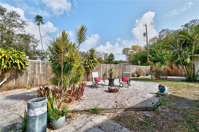 view of yard featuring a patio and a fire pit