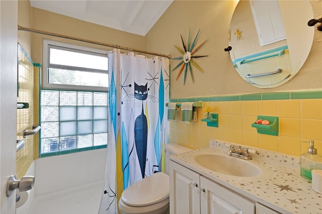 bathroom featuring toilet, tile walls, vanity, and a shower with curtain