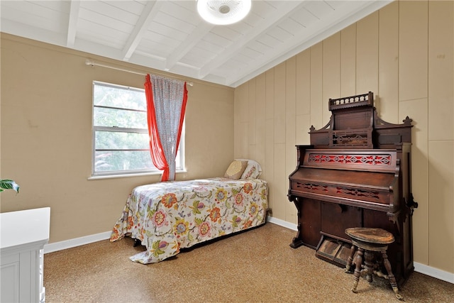 bedroom featuring vaulted ceiling with beams