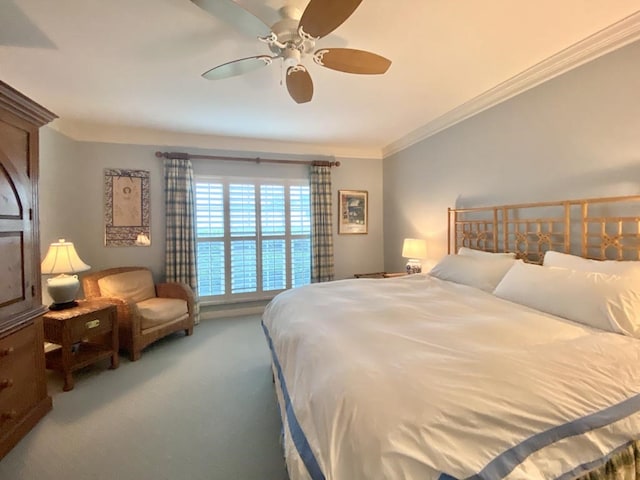 bedroom with carpet, ceiling fan, and crown molding