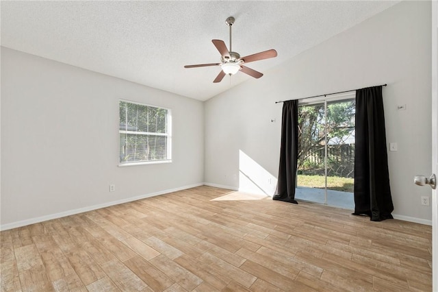 unfurnished room featuring light hardwood / wood-style floors, ceiling fan, and a healthy amount of sunlight