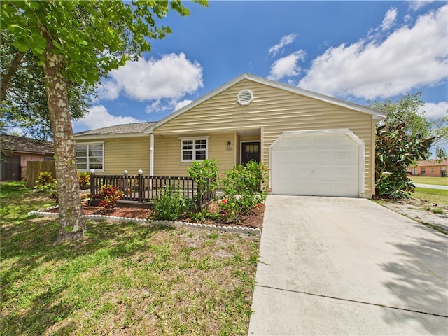 2297 Whiteside Ave SE, Palm Bay, FL 32909 - ranch-style home with an attached garage and concrete driveway