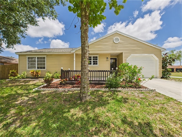 2297 Whiteside Ave SE, Palm Bay, FL 32909 - single story home featuring a garage, fence, driveway, and a front lawn