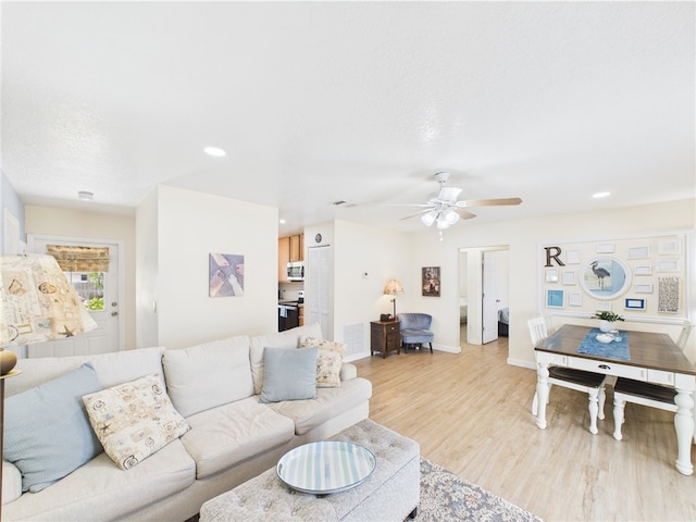 2297 Whiteside Ave SE, Palm Bay, FL 32909 - living area featuring a ceiling fan, visible vents, baseboards, light wood-style floors, and recessed lighting