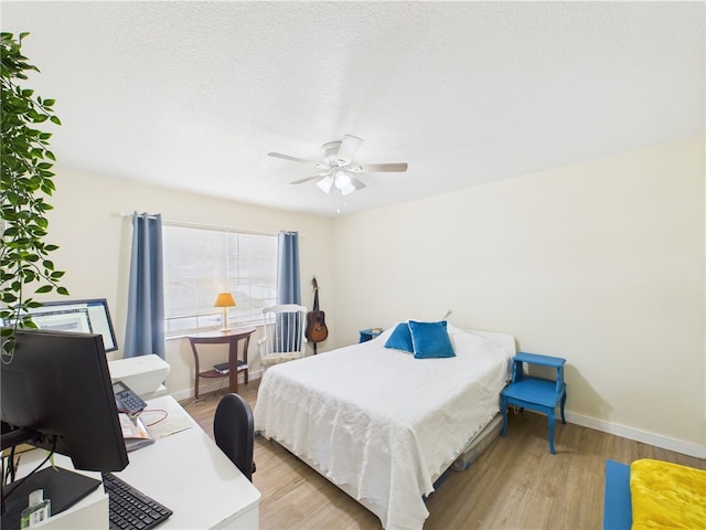 2297 Whiteside Ave SE, Palm Bay, FL 32909 - bedroom with a ceiling fan, baseboards, and light wood-style flooring