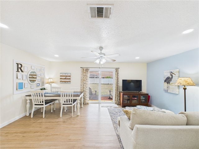 2297 Whiteside Ave SE, Palm Bay, FL 32909 - living room featuring ceiling fan, recessed lighting, baseboards, light wood-type flooring, and visible vents