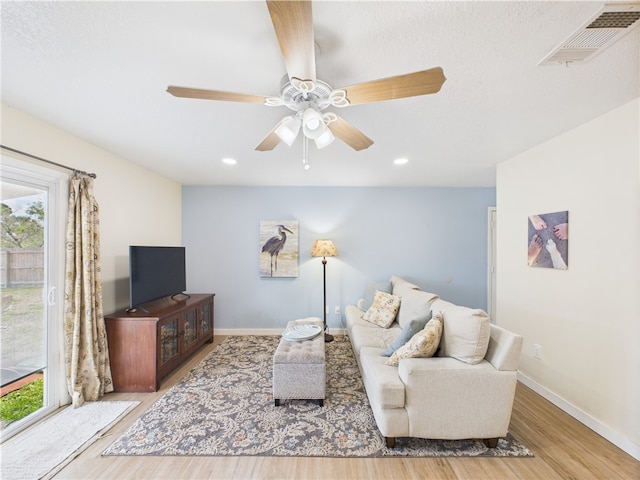 2297 Whiteside Ave SE, Palm Bay, FL 32909 - living area featuring visible vents, baseboards, ceiling fan, and wood finished floors