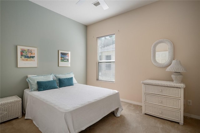 bedroom featuring light colored carpet