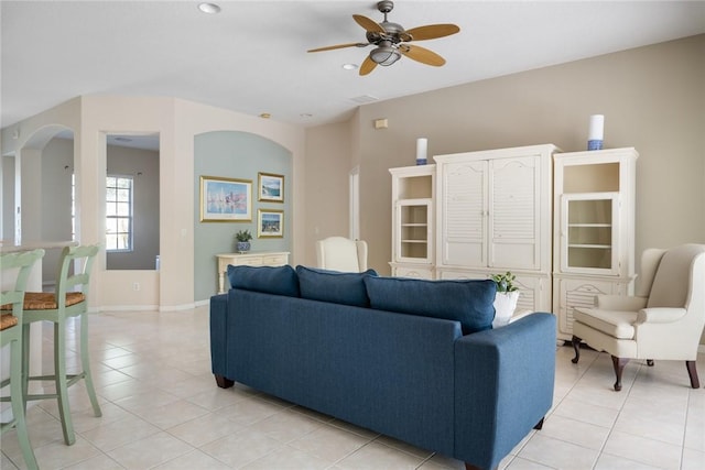 living room featuring ceiling fan and light tile patterned floors