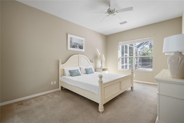 bedroom featuring ceiling fan and light colored carpet