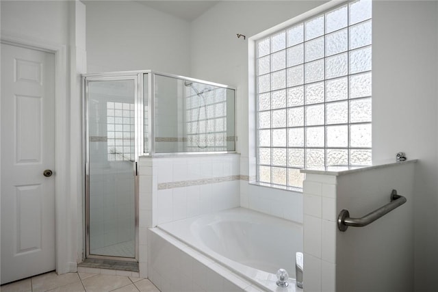 bathroom with tile patterned flooring and plus walk in shower