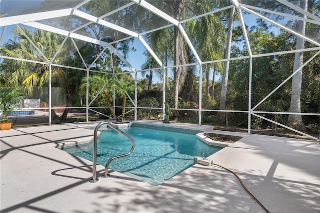 view of pool featuring a lanai and a patio area