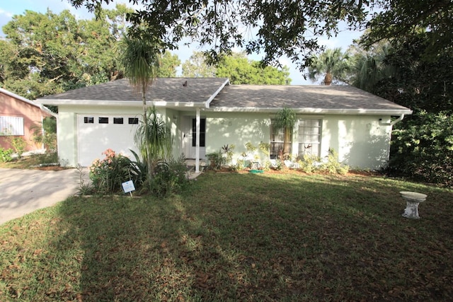 ranch-style house featuring a front lawn and a garage