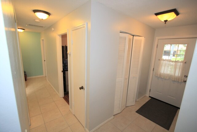 interior space with light tile patterned flooring