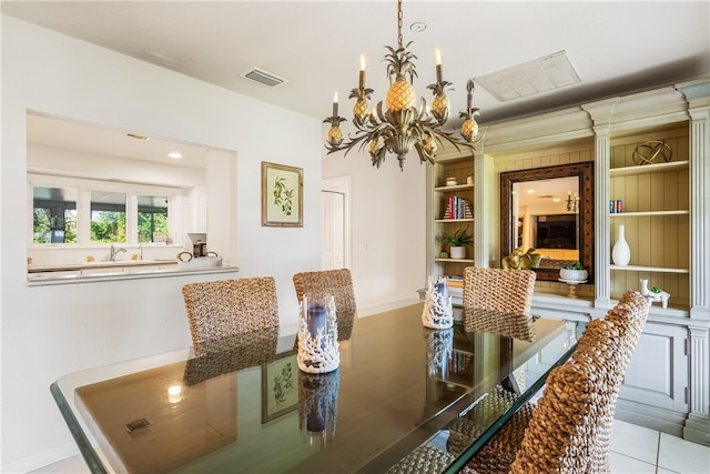 tiled dining area featuring an inviting chandelier