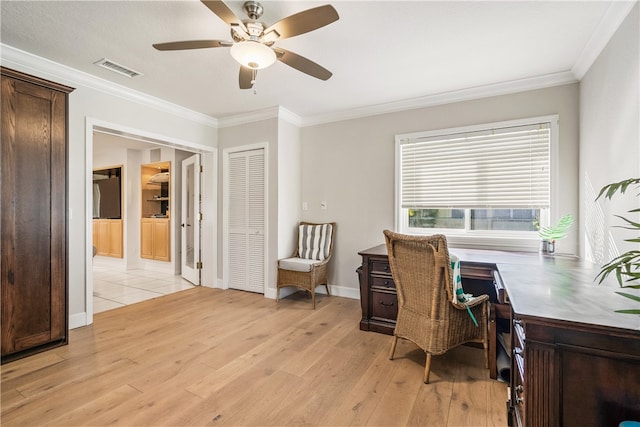 office area featuring light hardwood / wood-style floors, ceiling fan, and crown molding