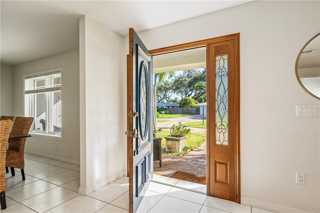 tiled foyer featuring a healthy amount of sunlight