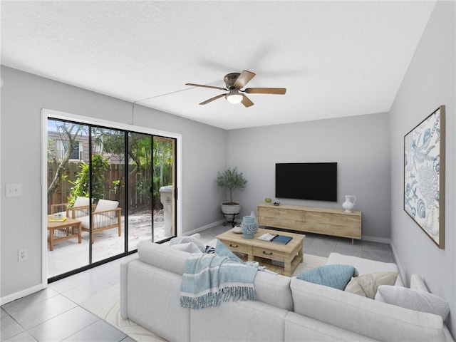 living room featuring ceiling fan and light tile patterned flooring