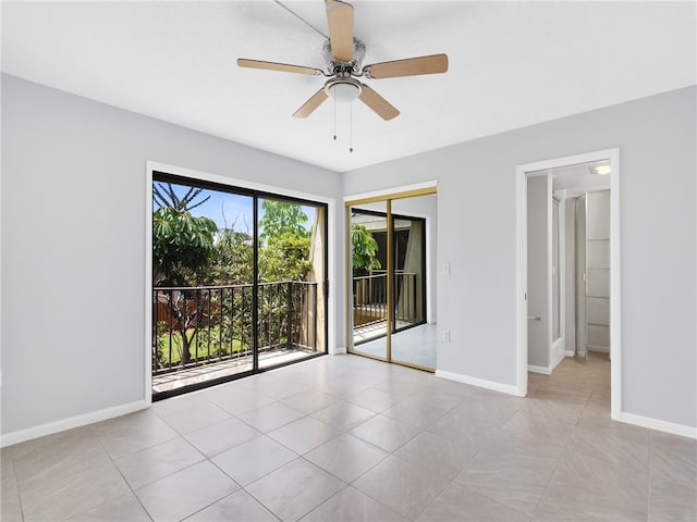 tiled empty room with ceiling fan