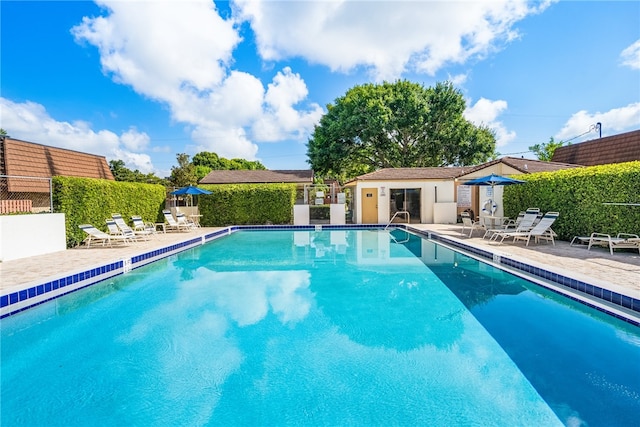 view of swimming pool featuring a patio area